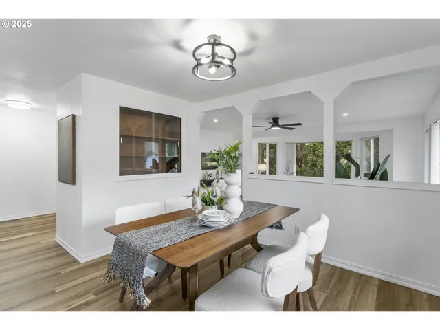 a dining room with furniture and window