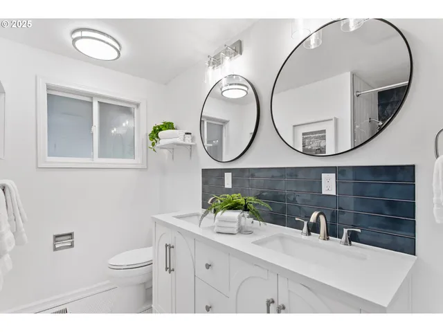 a bathroom with a sink mirror and vanity