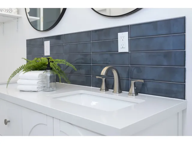 a living room with furniture a window and a table