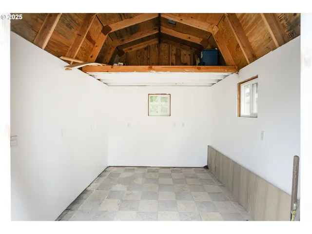 a backyard of a house with yard and trampoline