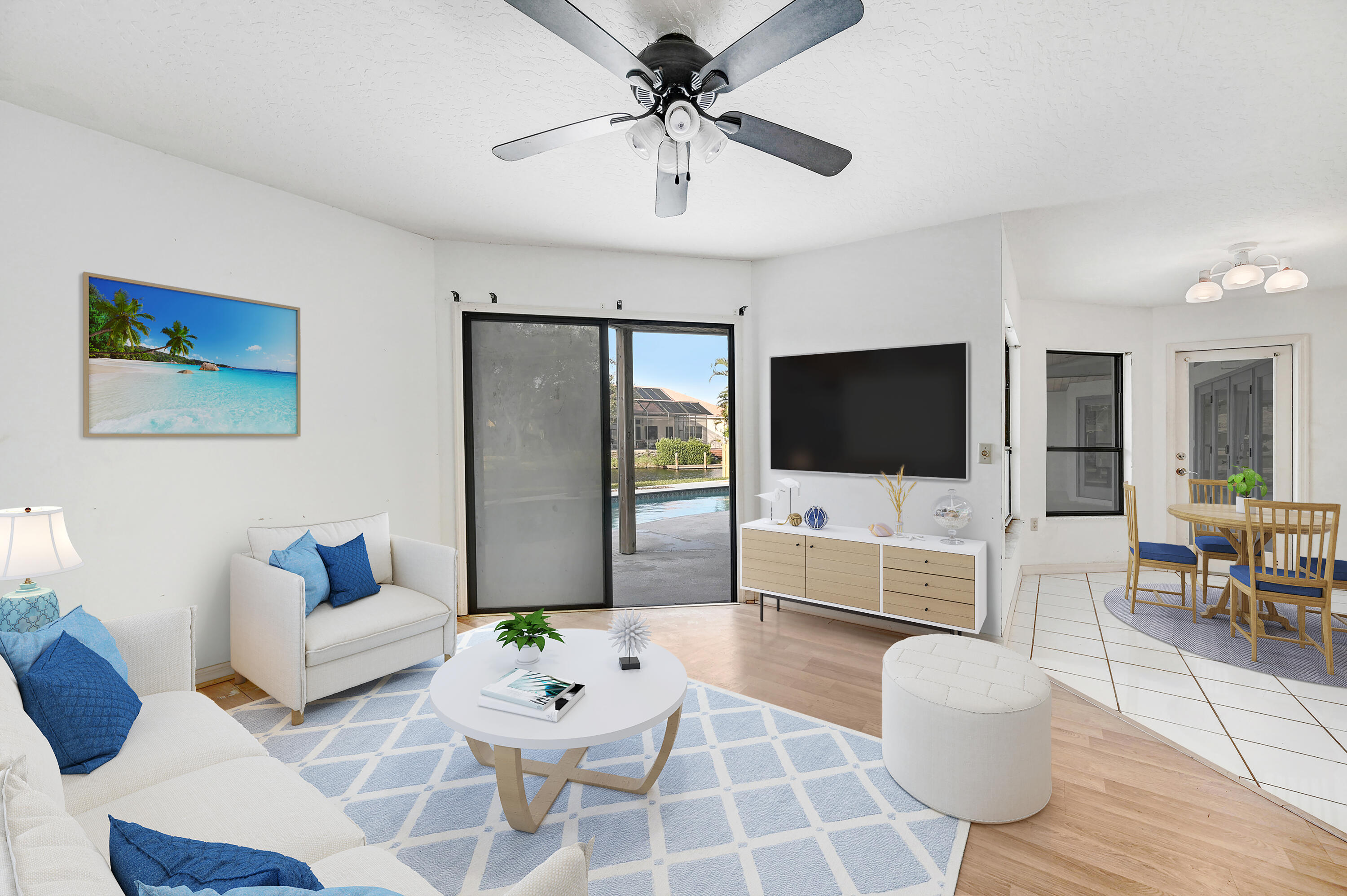 3 Inwood Way Indian Harbour Beach, FL 32937 - Photo 11 of 35 a living room with furniture and a flat screen tv