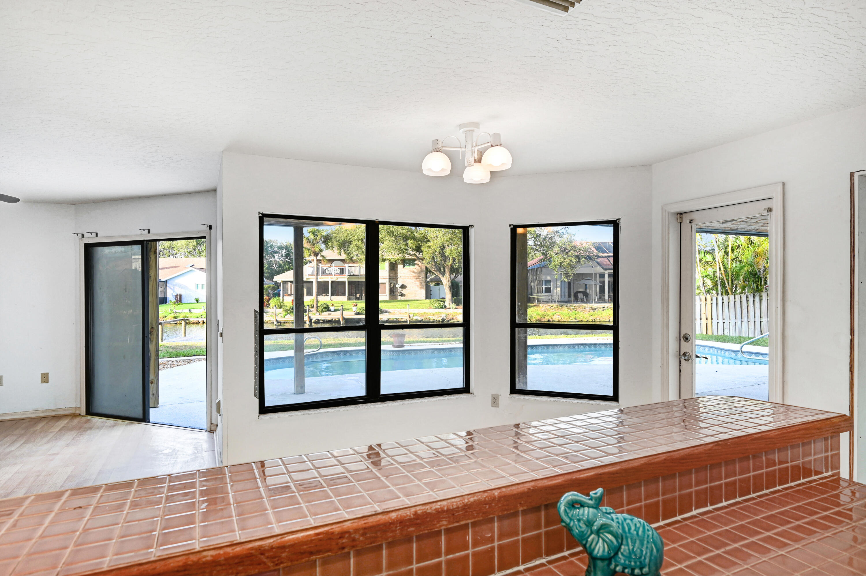 3 Inwood Way Indian Harbour Beach, FL 32937 - Photo 12 of 35 a view of a livingroom with wooden floor and windows