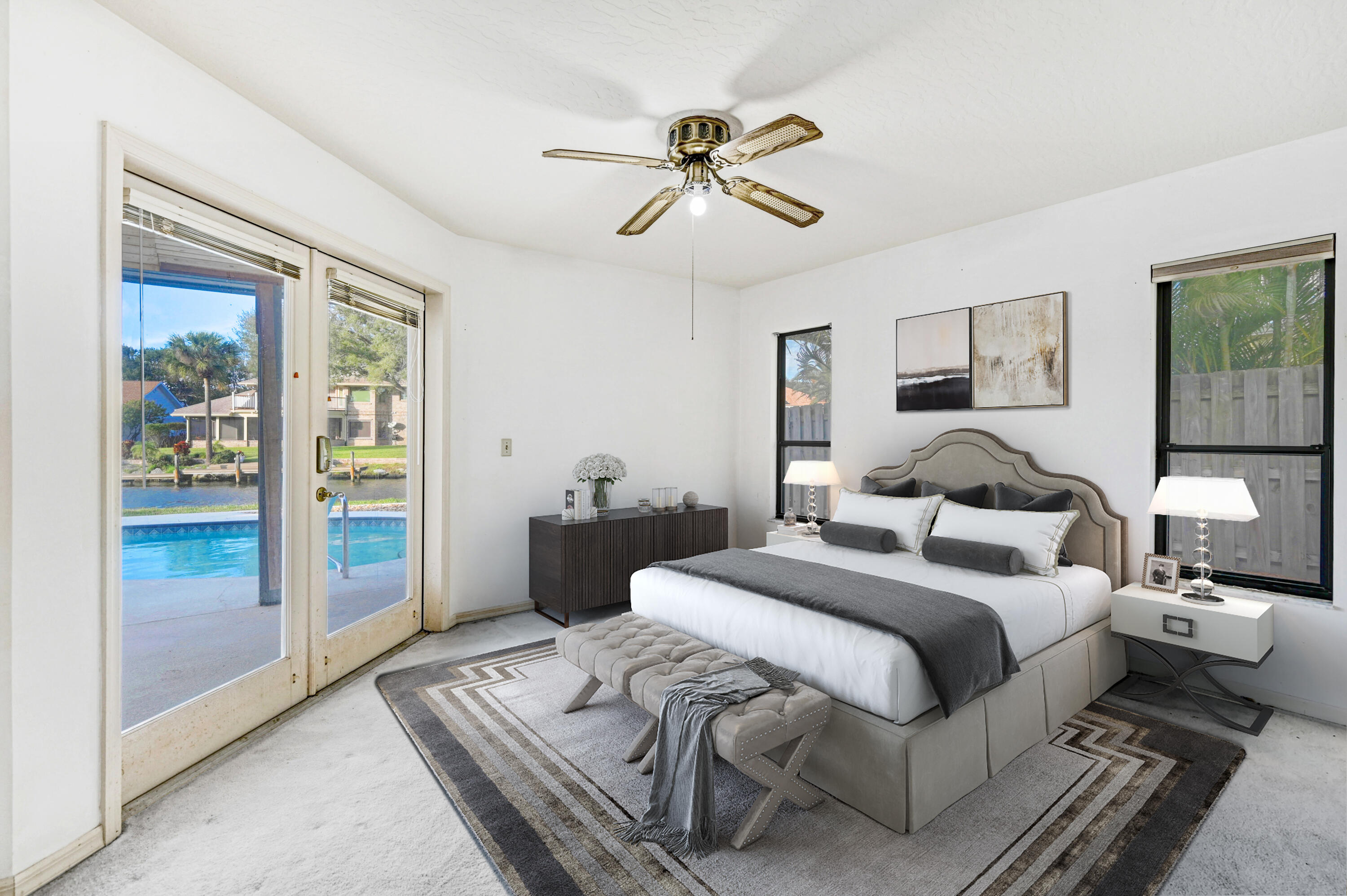 3 Inwood Way Indian Harbour Beach, FL 32937 - Photo 13 of 35 a bedroom with a large bed and a chandelier