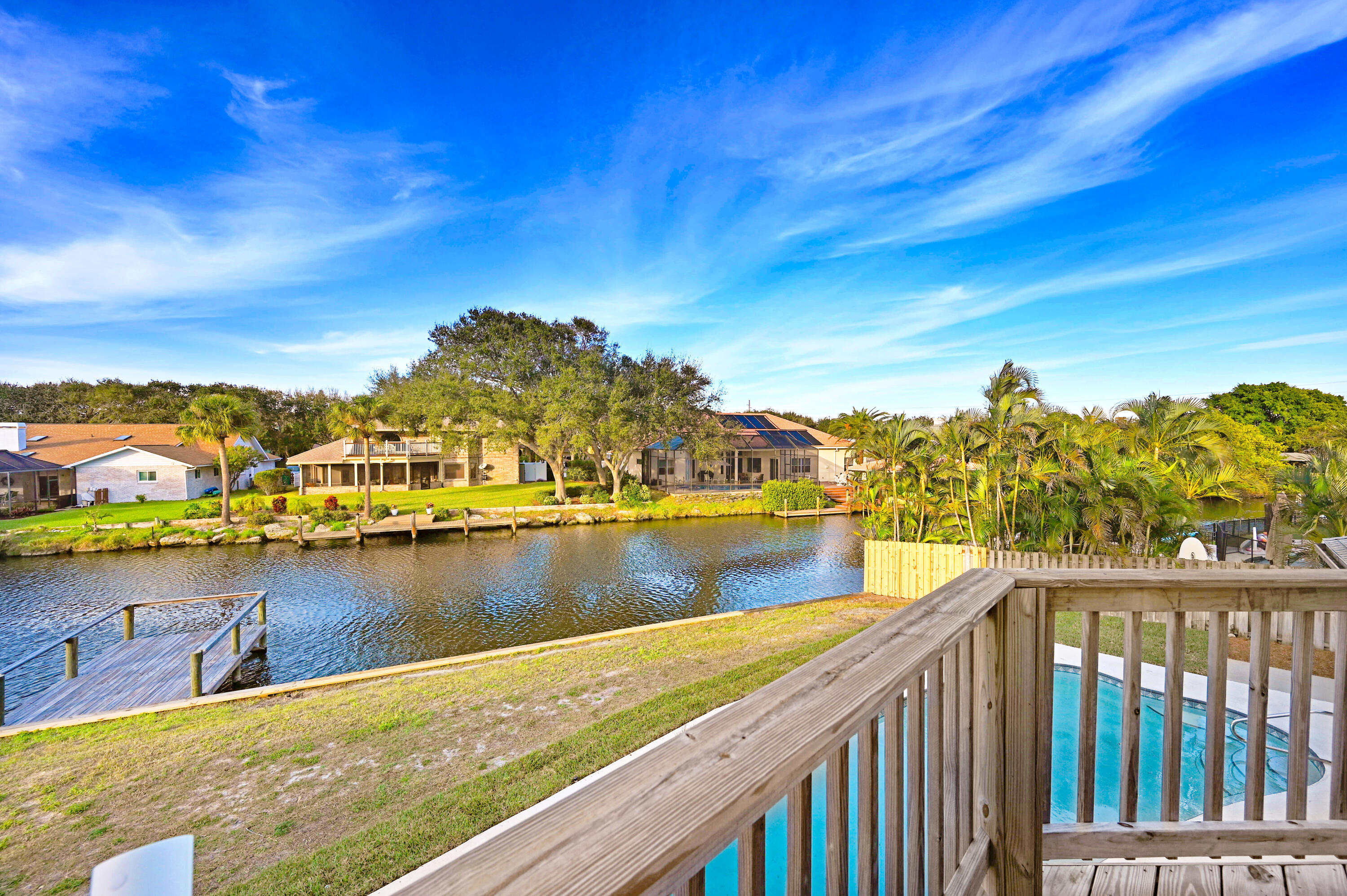 3 Inwood Way Indian Harbour Beach, FL 32937 - Photo 24 of 35 a view of a lake with a houses
