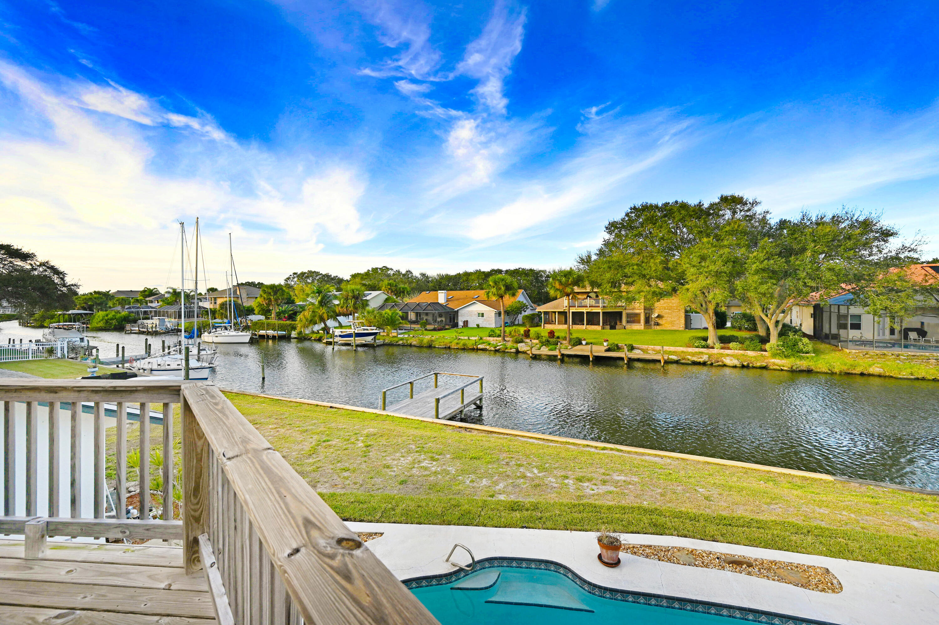 3 Inwood Way Indian Harbour Beach, FL 32937 - Photo 25 of 35 a view of a lake with houses in the back