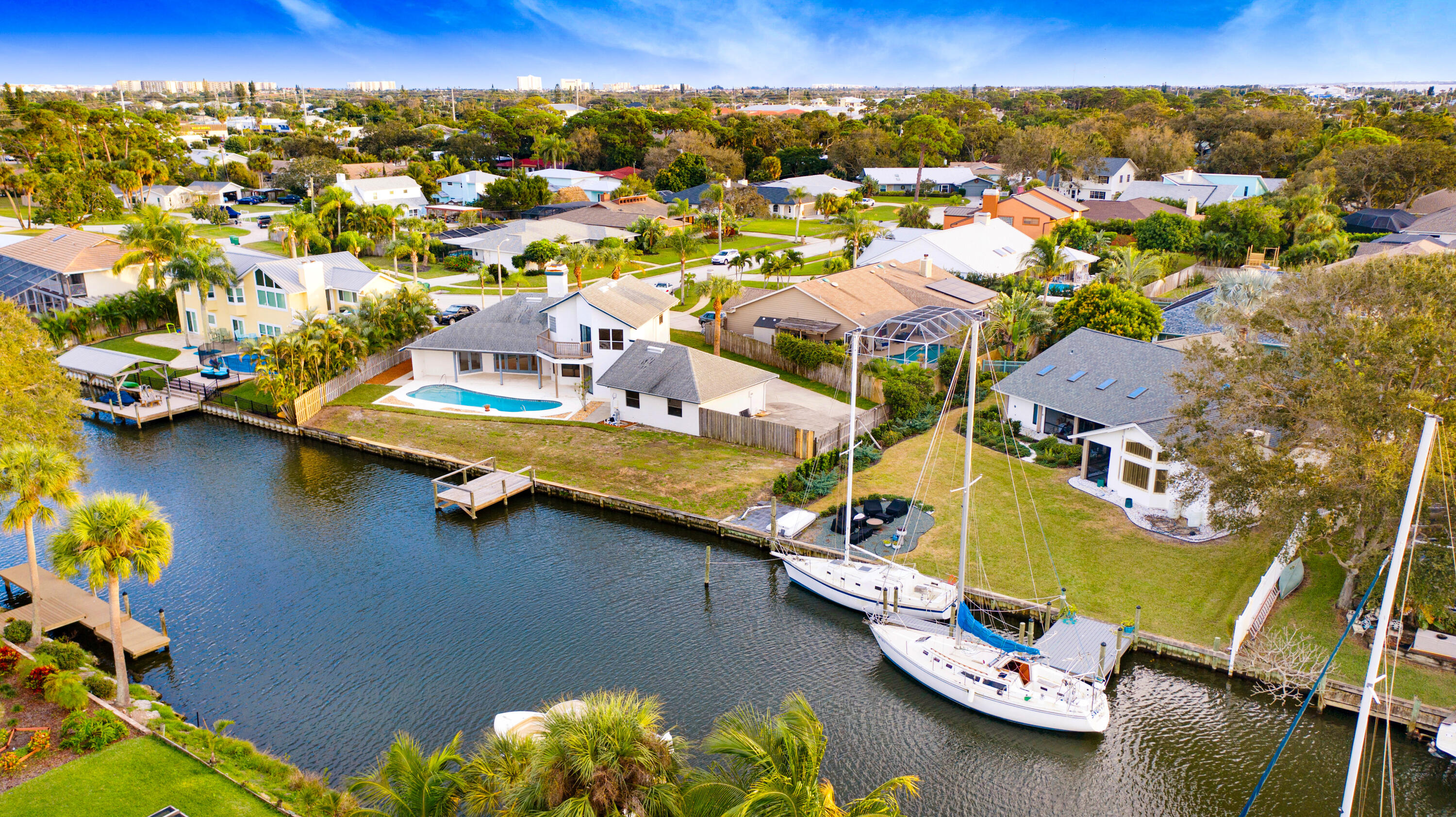 3 Inwood Way Indian Harbour Beach, FL 32937 - Photo 30 of 35 an aerial view of a house with a swimming pool yard and outdoor seating