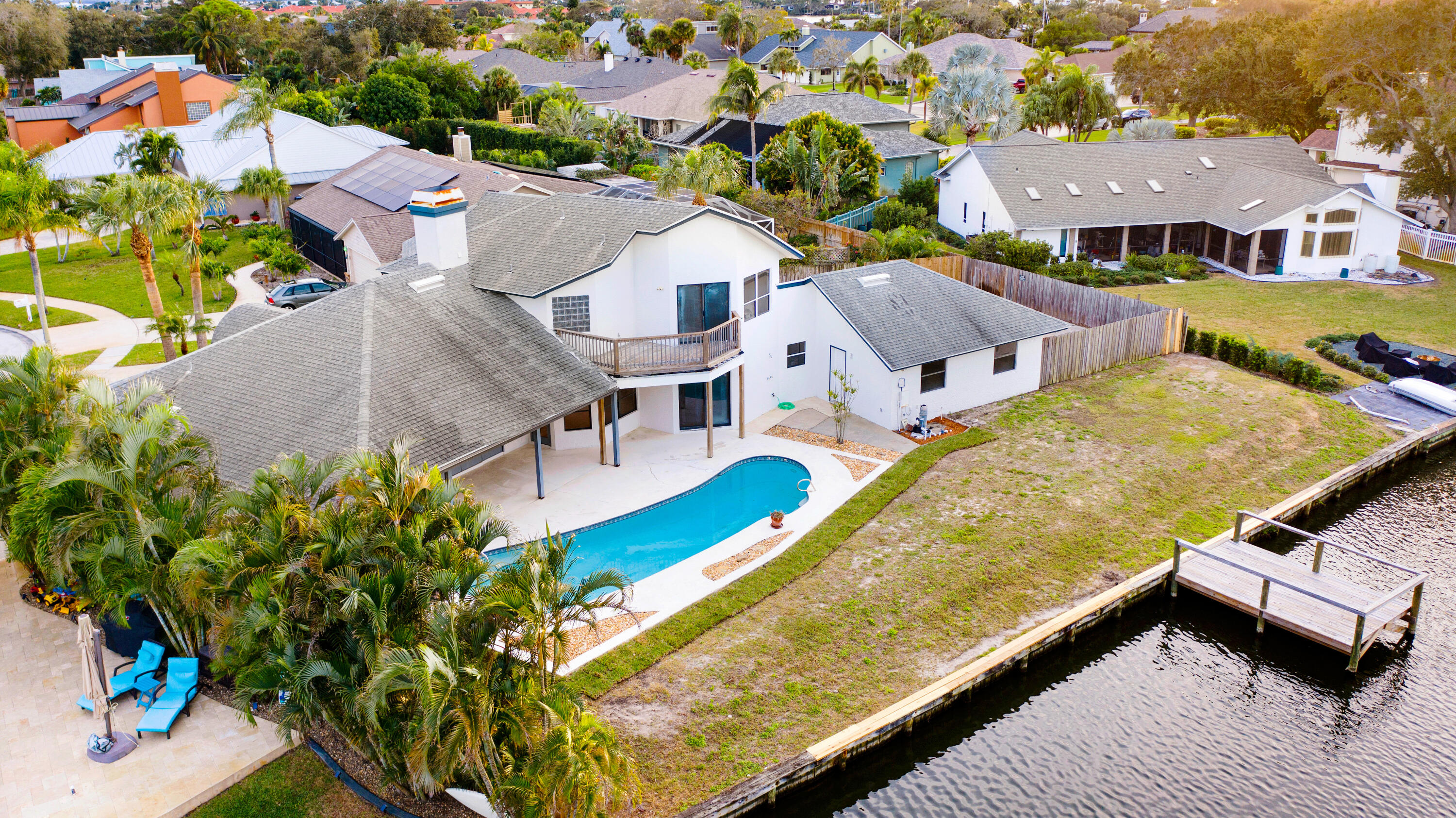 3 Inwood Way Indian Harbour Beach, FL 32937 - Photo 3 of 35 an aerial view of residential houses with outdoor space and swimming pool