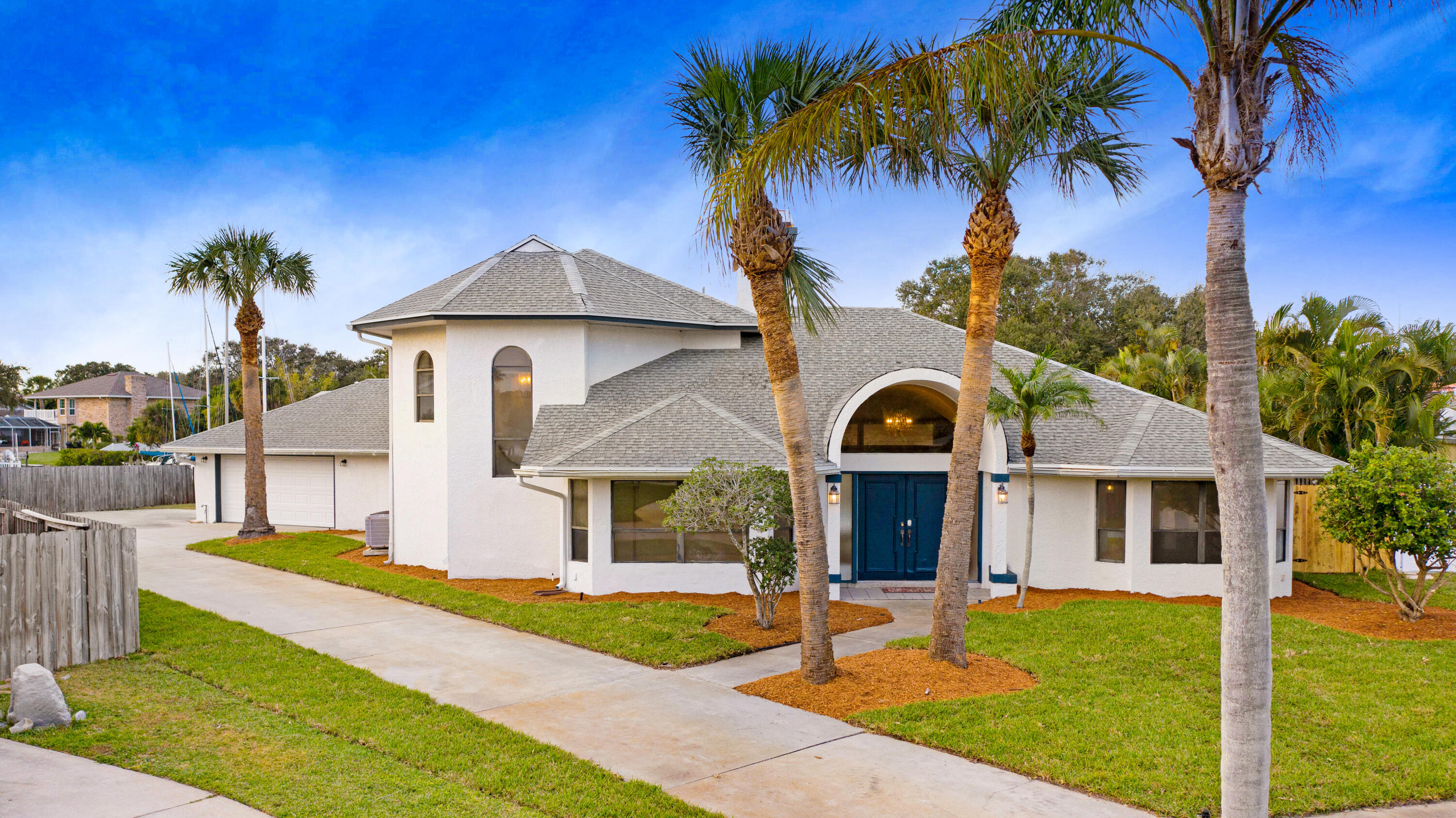 3 Inwood Way Indian Harbour Beach, FL 32937 - Photo 34 of 35 a front view of a house with garden