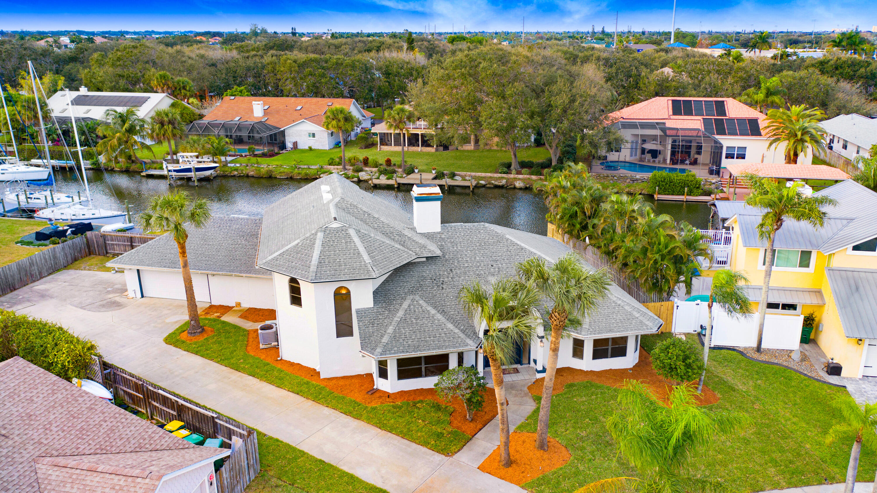 3 Inwood Way Indian Harbour Beach, FL 32937 - Photo 35 of 35 an aerial view of a house with swimming pool lake view and mountain view