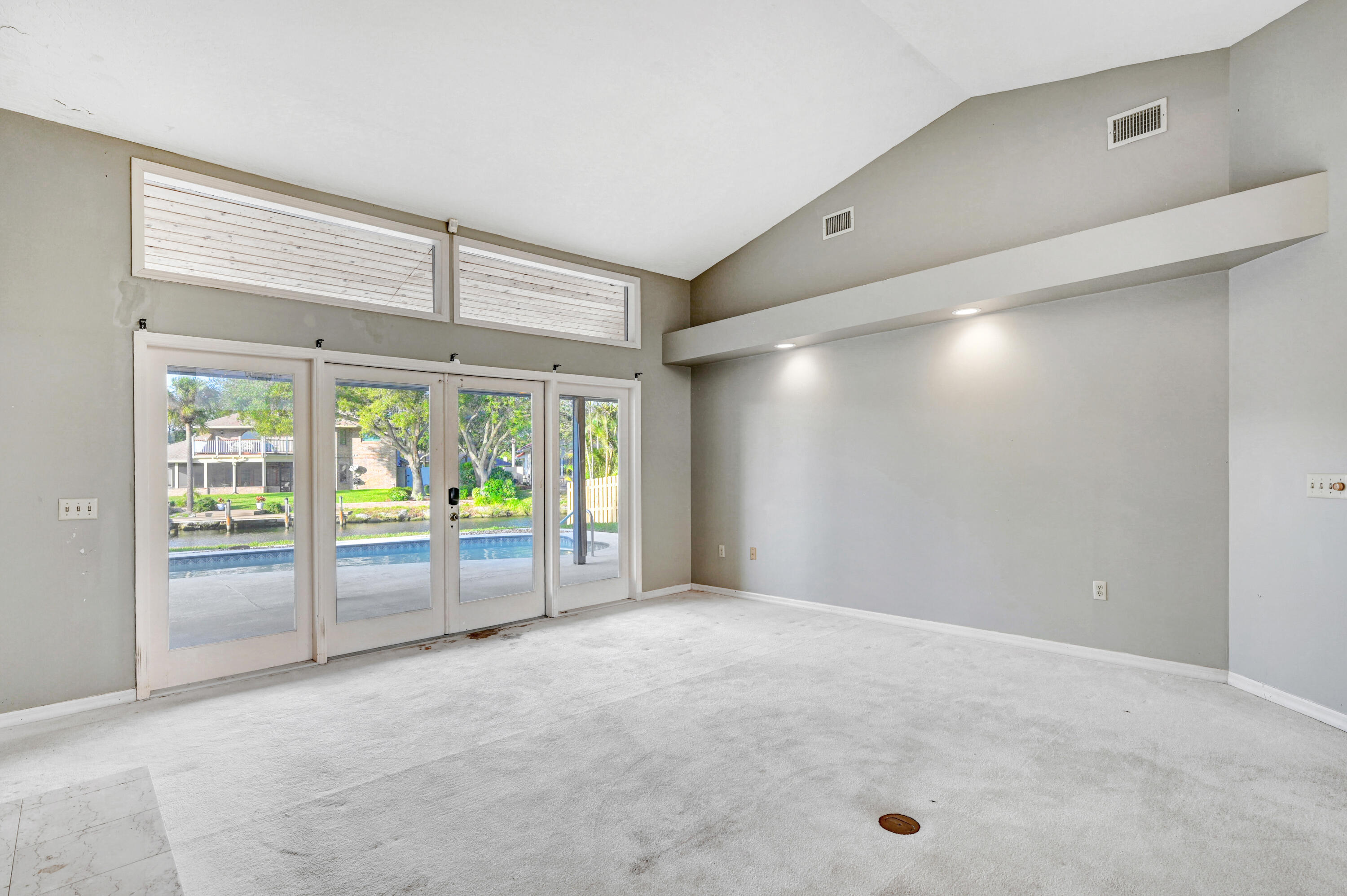 3 Inwood Way Indian Harbour Beach, FL 32937 - Photo 6 of 35 a view of an empty room with a sliding door