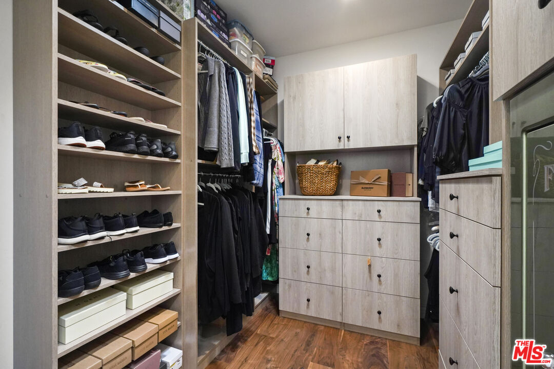6544 Wandermere Road Malibu, CA 90265 - Photo 13 of 36 a view of walk in closet with clothes and shoes