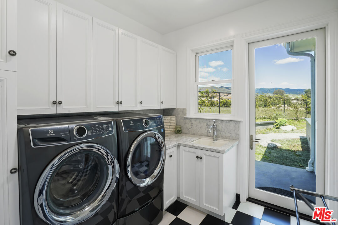 6544 Wandermere Road Malibu, CA 90265 - Photo 29 of 36 a utility room with sink dryer and washer