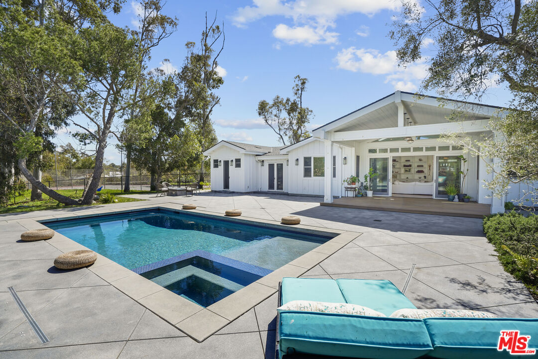 6544 Wandermere Road Malibu, CA 90265 - Photo 3 of 36 a view of a house with swimming pool and sitting area