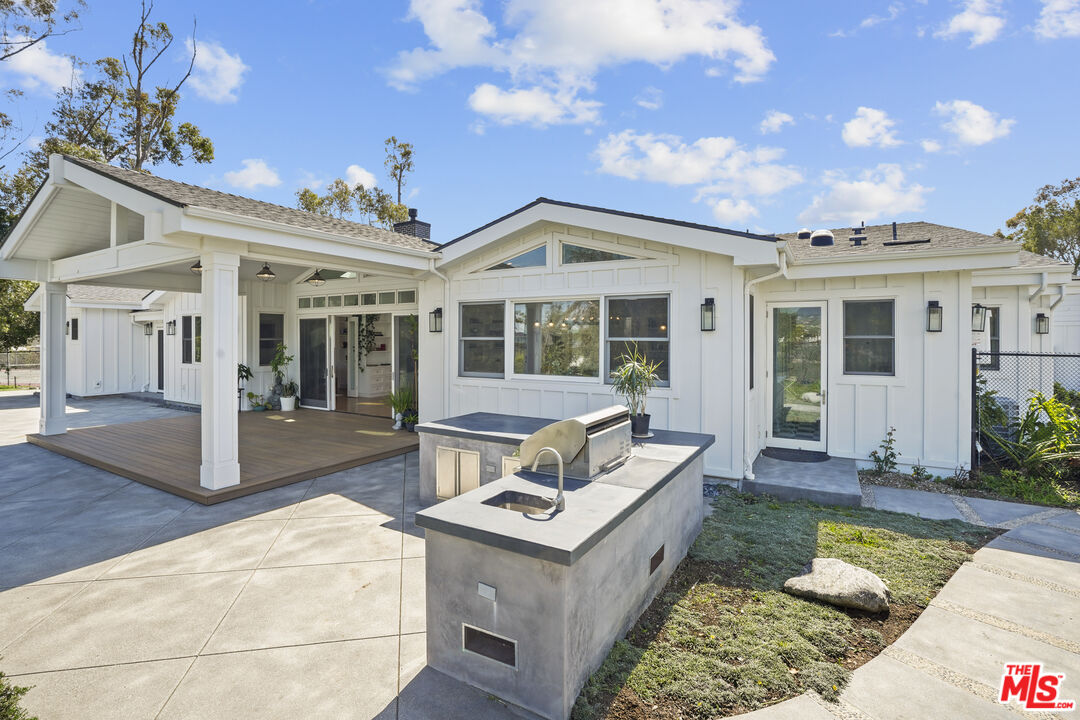 6544 Wandermere Road Malibu, CA 90265 - Photo 33 of 36 a view of a house with swimming pool and sitting area