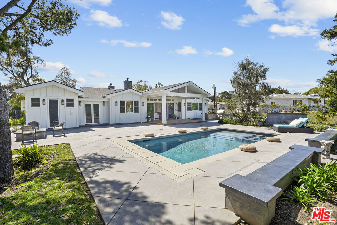 6544 Wandermere Road Malibu, CA 90265 - Photo 34 of 36 a view of a house with swimming pool and sitting area