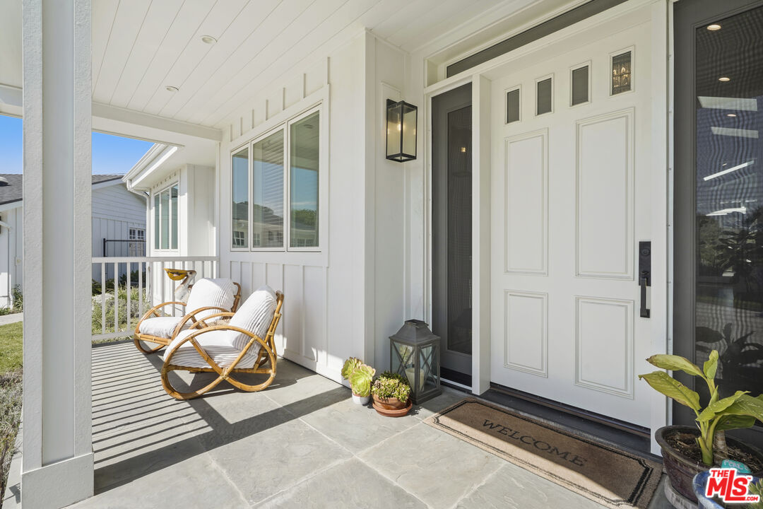 6544 Wandermere Road Malibu, CA 90265 - Photo 4 of 36 a bedroom with furniture and a window