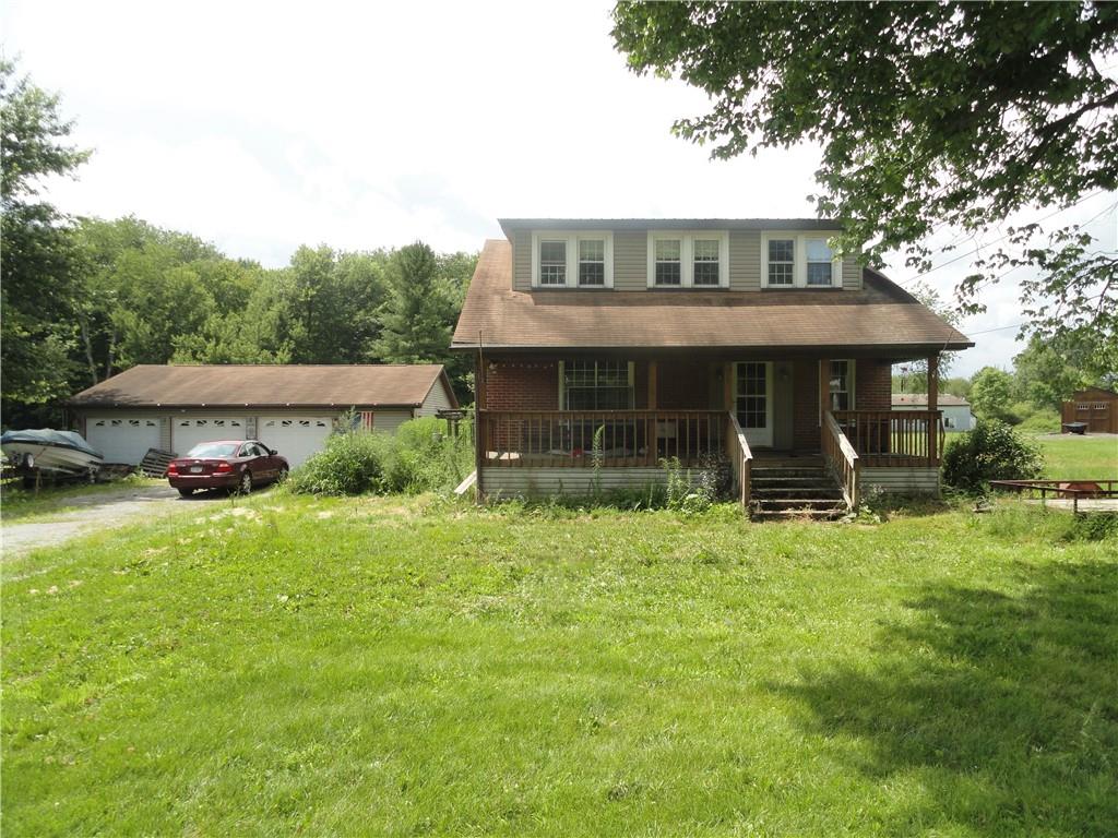 451 Mercer Road Greenville, PA 16125 - Photo 1 of 14 a front view of a house with a yard table and chairs