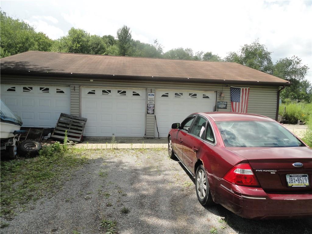 451 Mercer Road Greenville, PA 16125 - Photo 12 of 14 a front view of a house with parking space