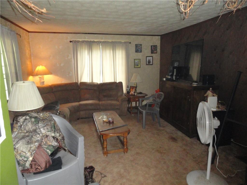 451 Mercer Road Greenville, PA 16125 - Photo 2 of 14 a living room with furniture and a window