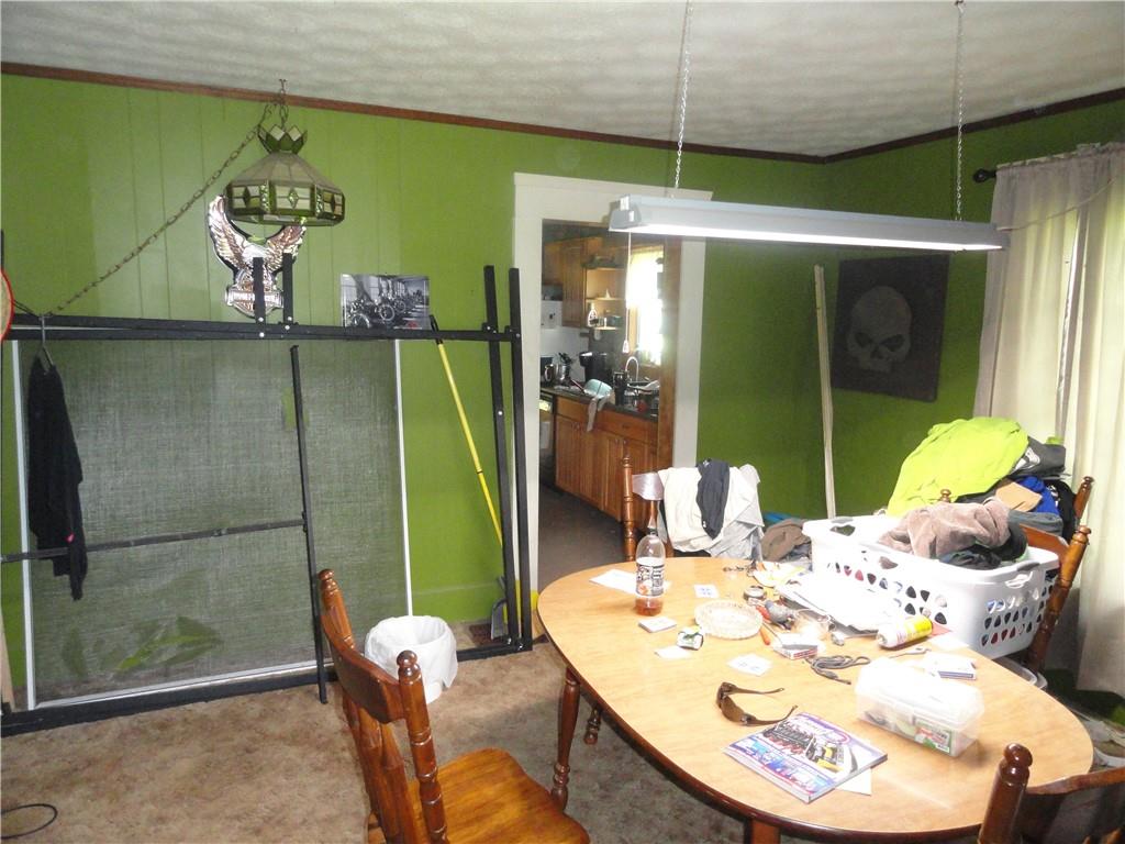 451 Mercer Road Greenville, PA 16125 - Photo 3 of 14 a dining room with furniture and a chandelier