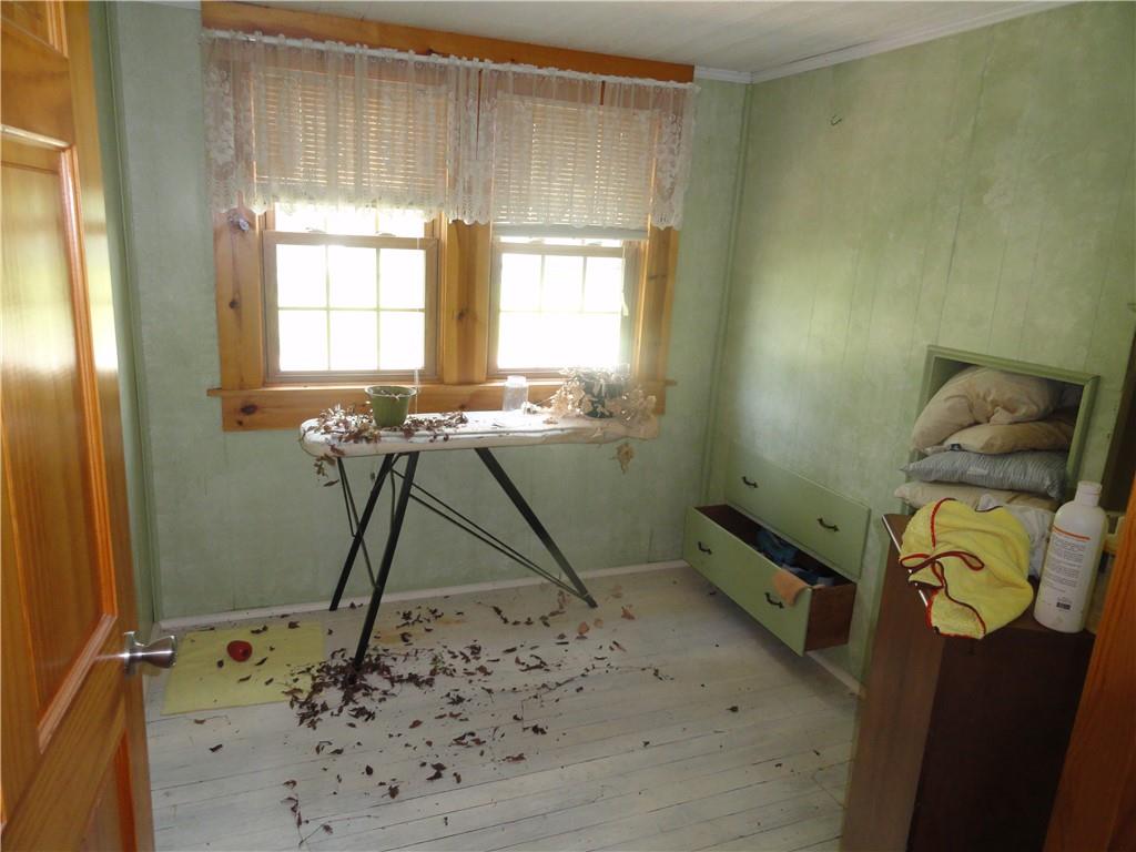 451 Mercer Road Greenville, PA 16125 - Photo 8 of 14 a room with window wooden floor and a table chair