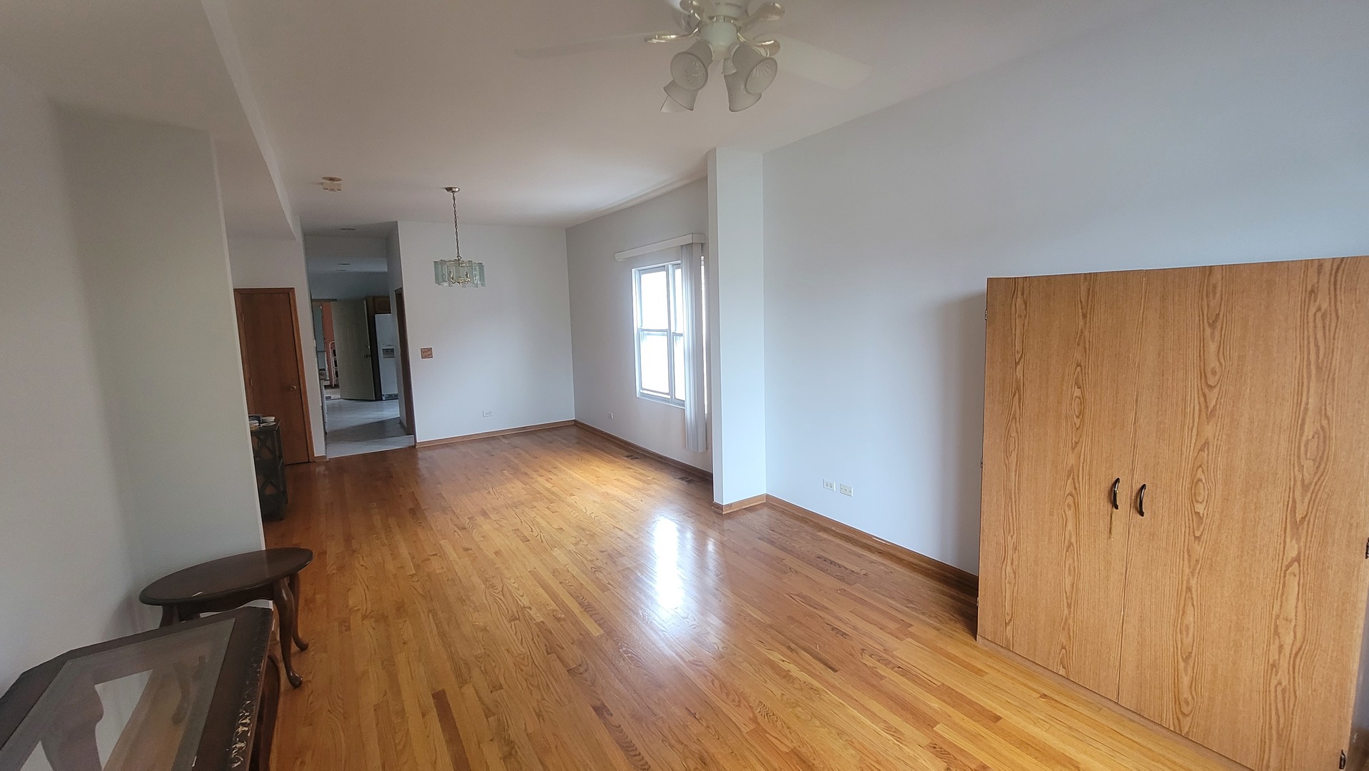 2977 North Lawndale Avenue, Unit 2 Chicago, IL 60618 - Photo 15 of 15 an empty room with wooden floor and windows
