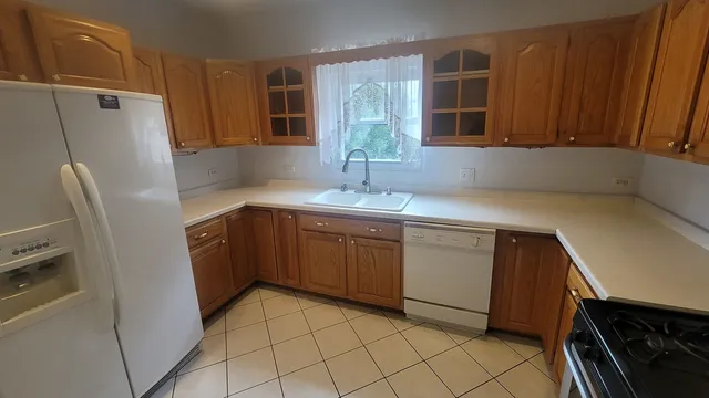 a kitchen with a sink cabinets and stainless steel appliances