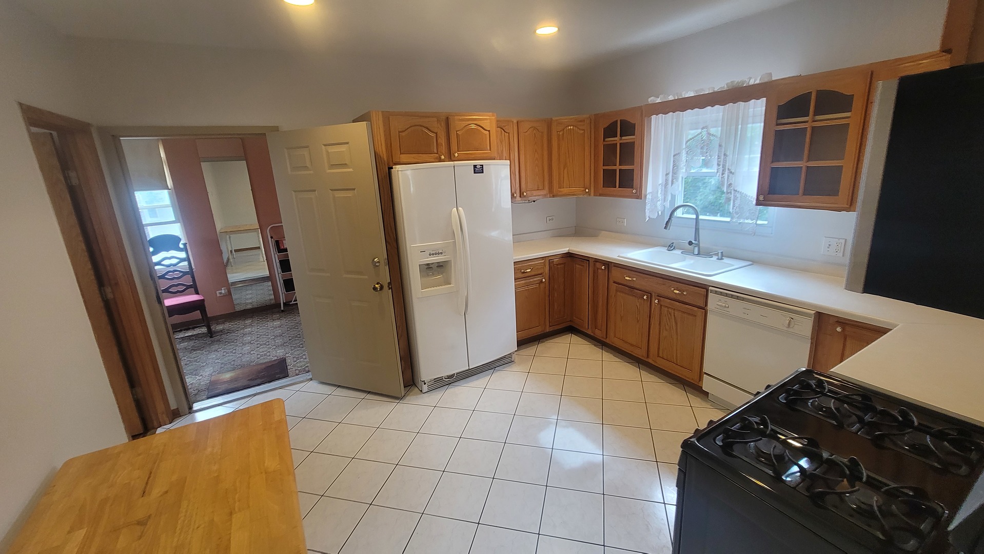 2977 North Lawndale Avenue, Unit 2 Chicago, IL 60618 - Photo 9 of 15 a kitchen with a stove a refrigerator and a sink