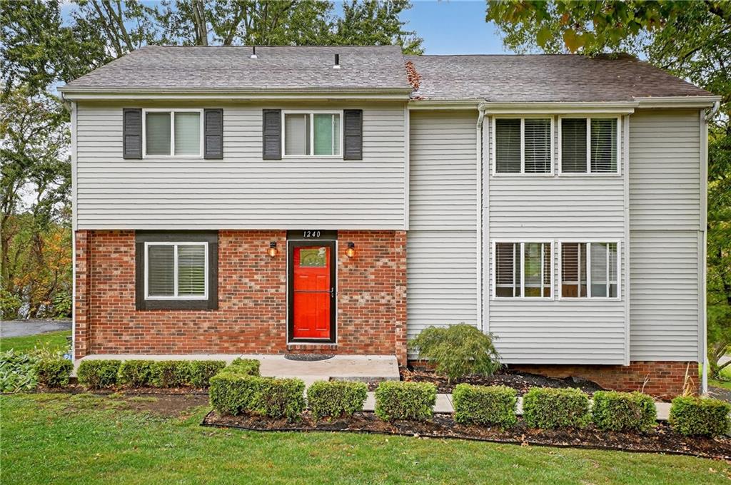 1240 Manor Drive Upper St. Clair, PA 15241 - Photo 1 of 24 a front view of a house with a yard