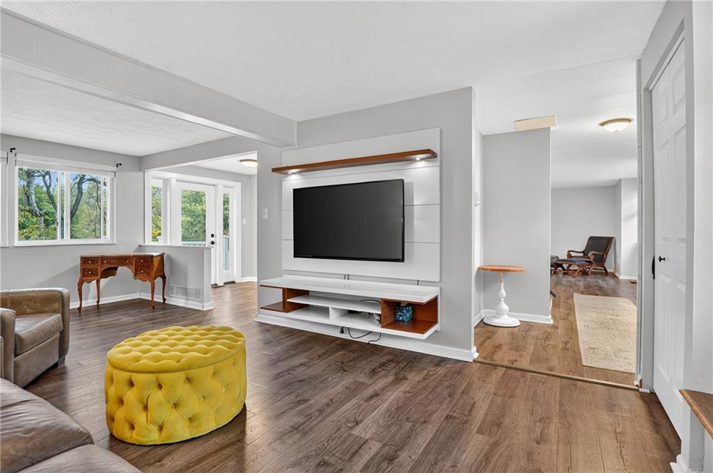 1240 Manor Drive Upper St. Clair, PA 15241 - Photo 11 of 24 a living room with furniture and a flat screen tv