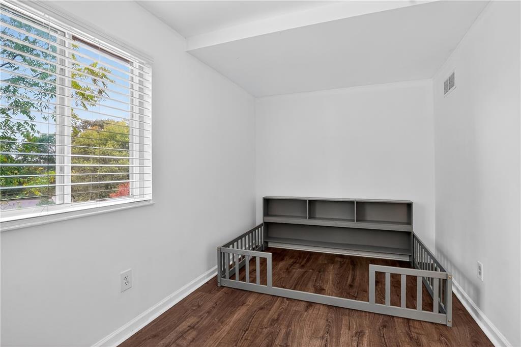 1240 Manor Drive Upper St. Clair, PA 15241 - Photo 15 of 24 a view of an empty room with wooden floor and a window