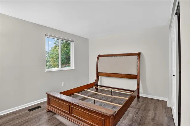 a room with chair and wooden floor