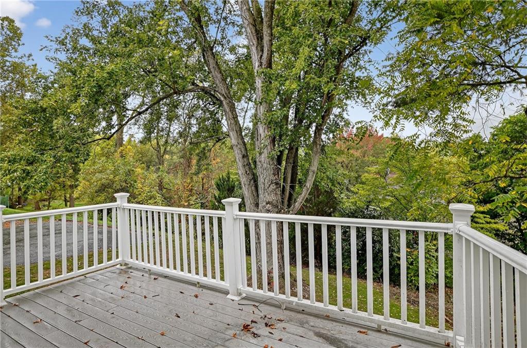 1240 Manor Drive Upper St. Clair, PA 15241 - Photo 21 of 24 a balcony with wooden floor and fence