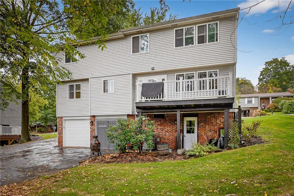 1240 Manor Drive Upper St. Clair, PA 15241 - Photo 23 of 24 a view of an house with backyard space and balcony