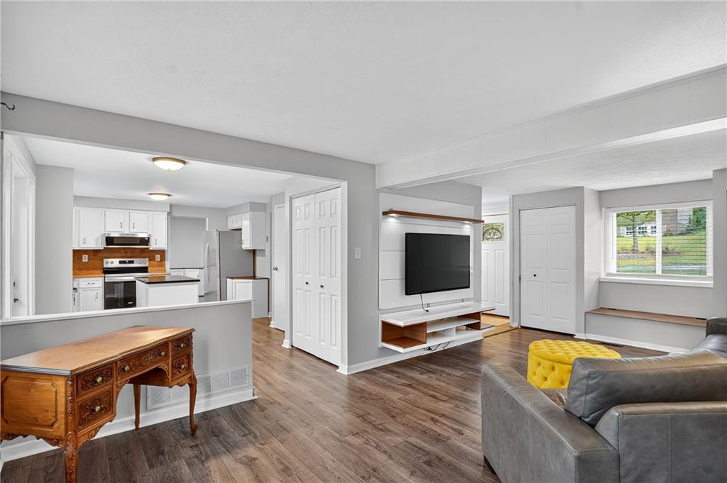 1240 Manor Drive Upper St. Clair, PA 15241 - Photo 10 of 24 a living room with furniture and a flat screen tv