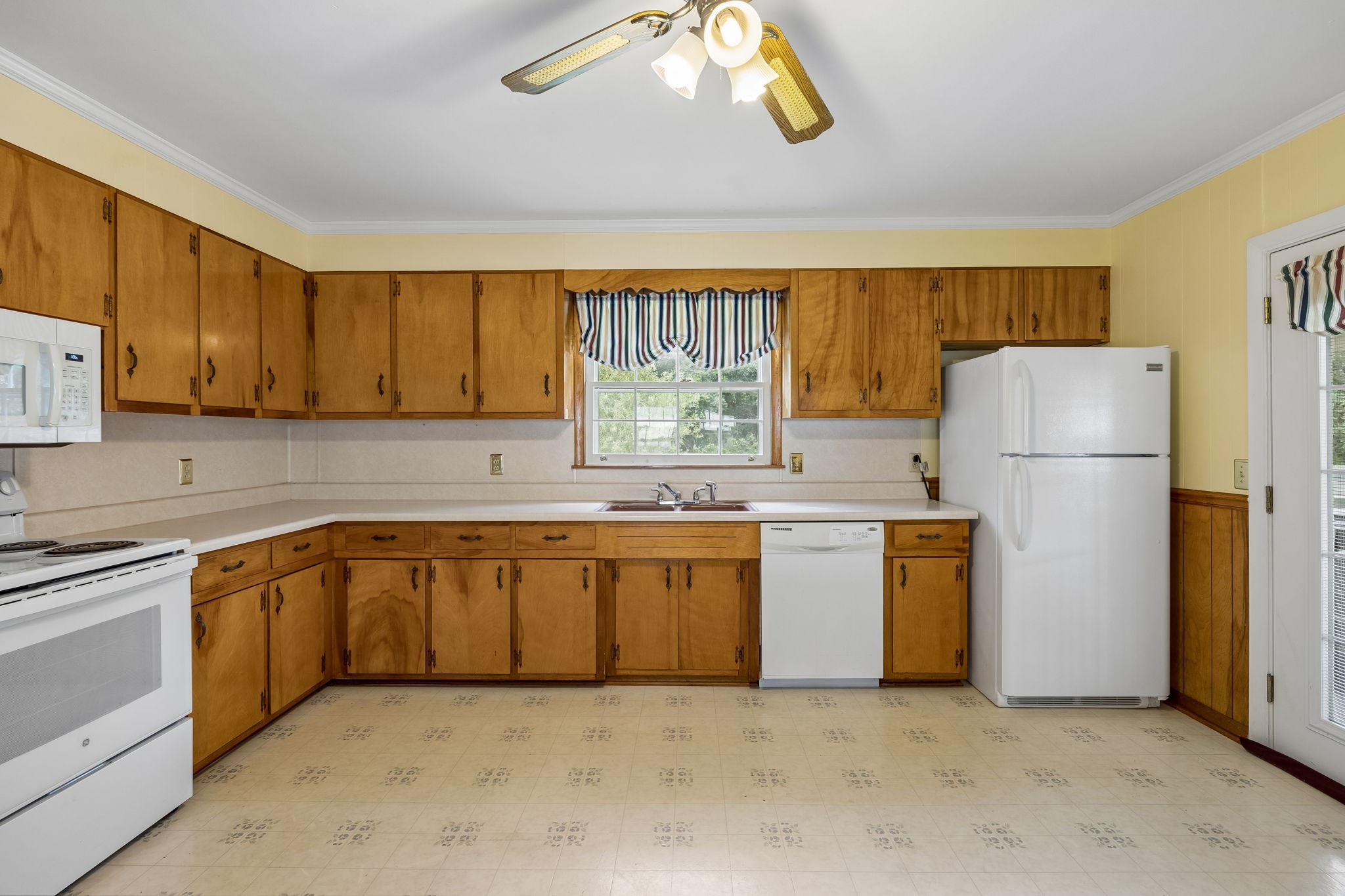 708 Hickory Street Centerville, TN 37033 - Photo 15 of 57 a kitchen with refrigerator and cabinets
