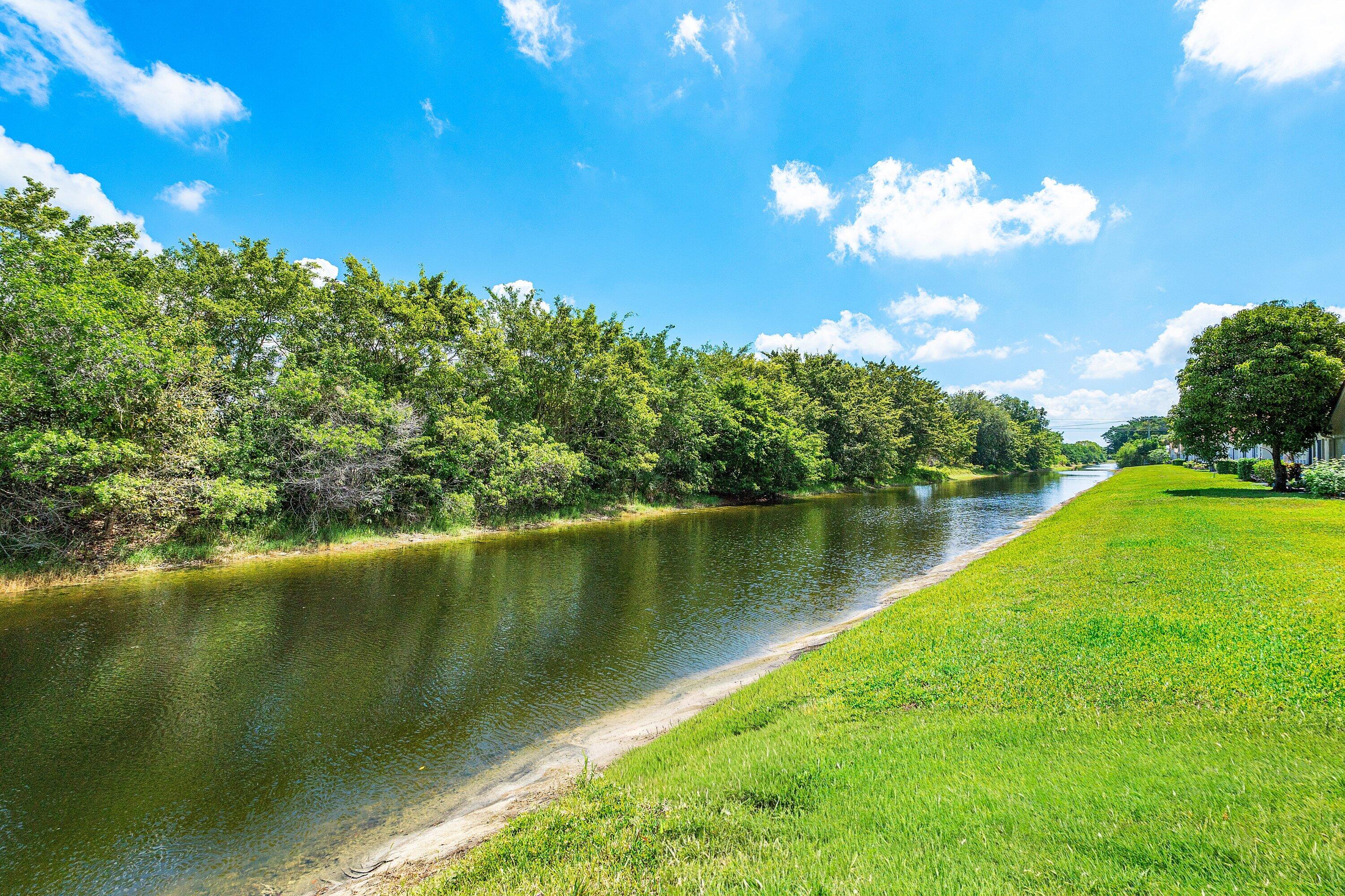 11163 180th Court South Boca Raton, FL 33498 - Photo 5 of 22 a view of a lake with a yard