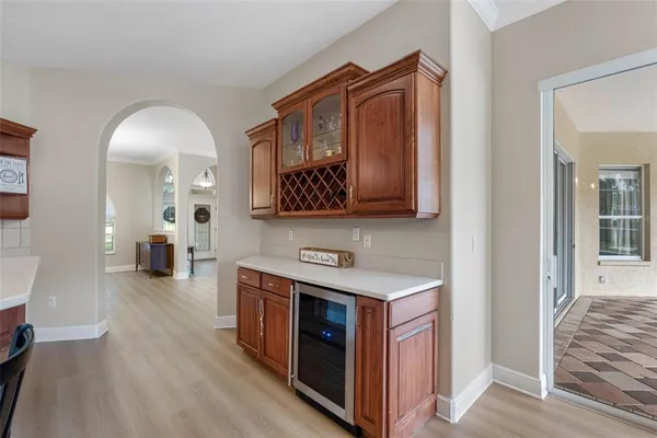 a hallway with a sink and a mirror