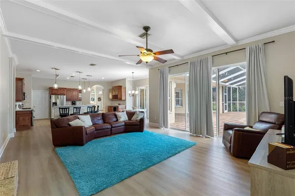 a living room with fireplace furniture and a flat screen tv