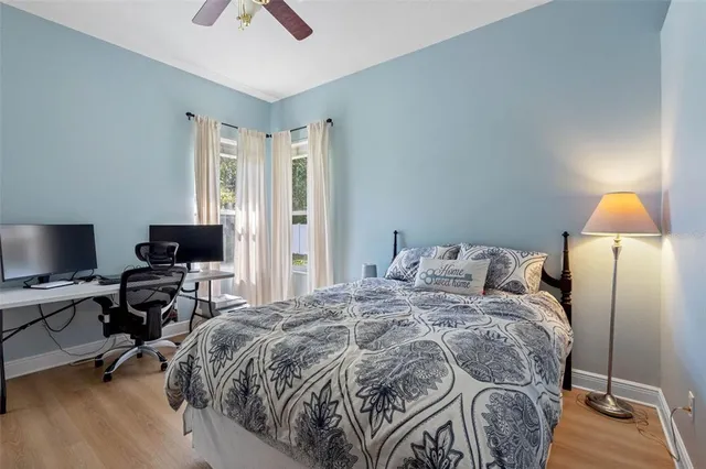 a bathroom with a granite countertop toilet sink and mirror