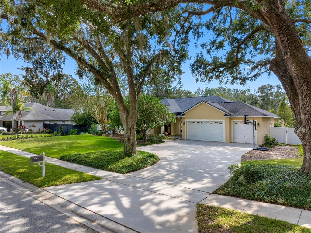 121 Myrtle Ridge Road Lutz, FL 33549 - Photo 3 of 42 a front view of a house with garden