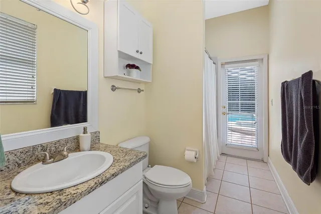 a bedroom with furniture and a book shelf