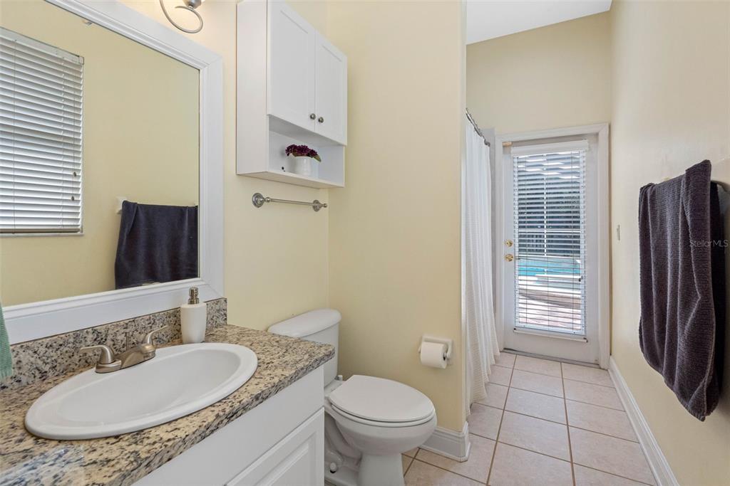 121 Myrtle Ridge Road Lutz, FL 33549 - Photo 31 of 42 a bathroom with a granite countertop toilet sink and mirror