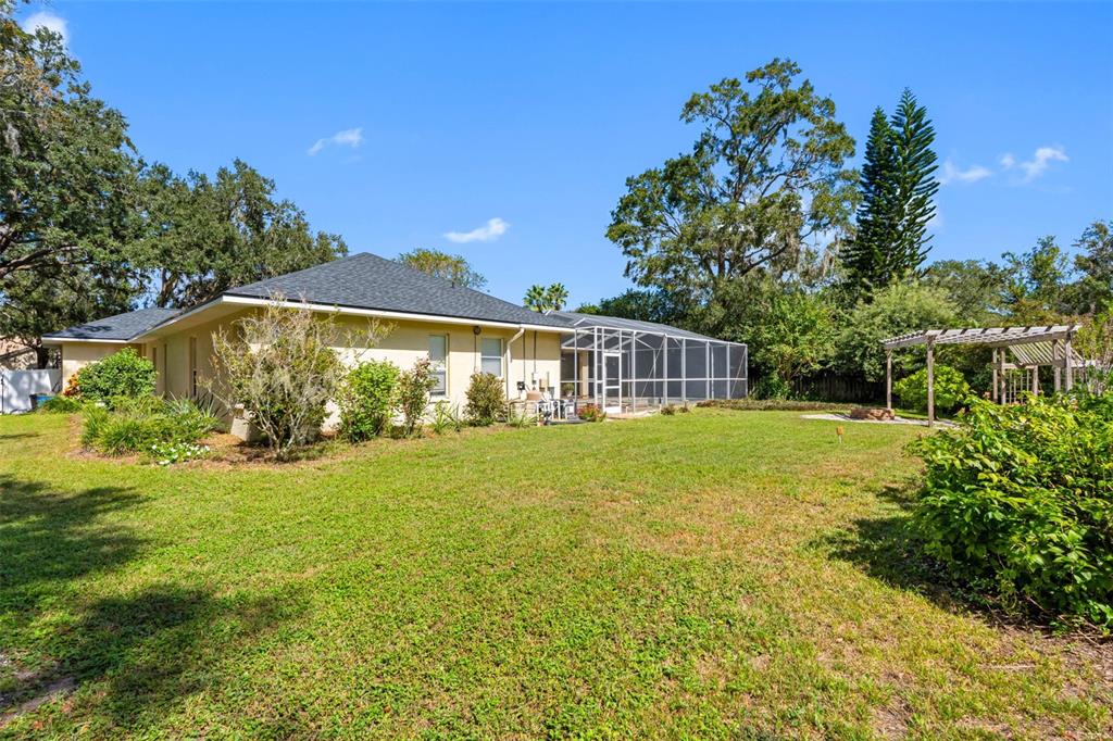121 Myrtle Ridge Road Lutz, FL 33549 - Photo 36 of 42 a view of a house with a yard