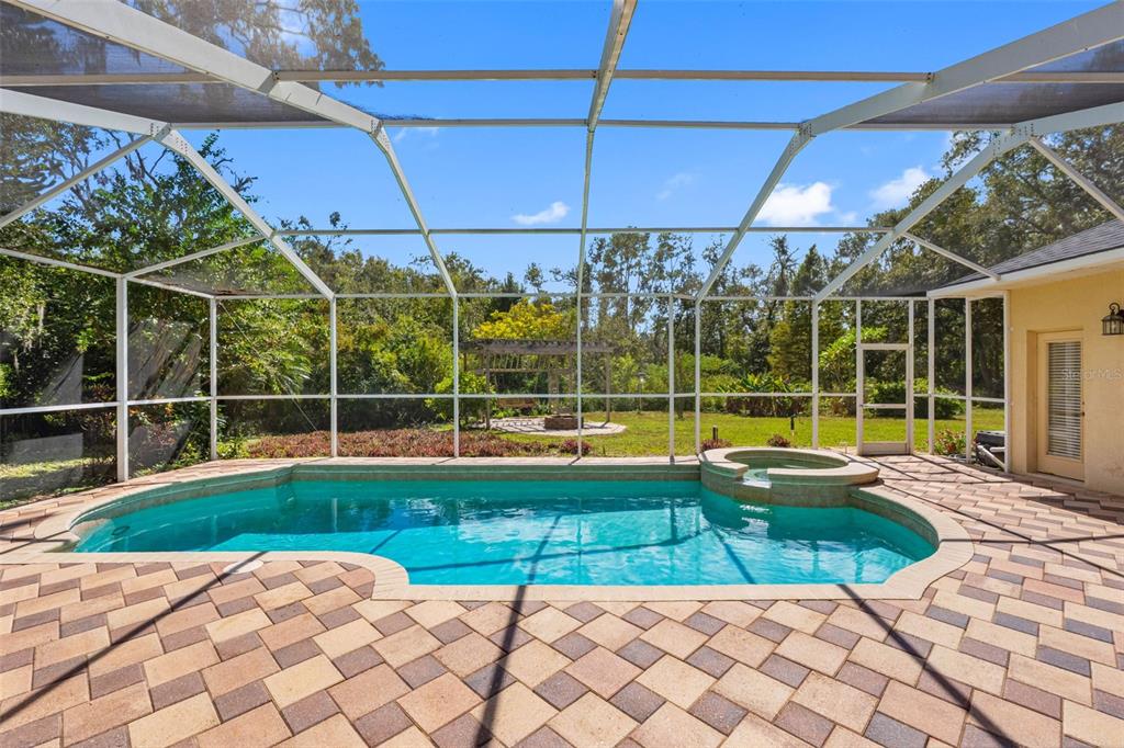 121 Myrtle Ridge Road Lutz, FL 33549 - Photo 6 of 42 a view of a backyard with sitting area