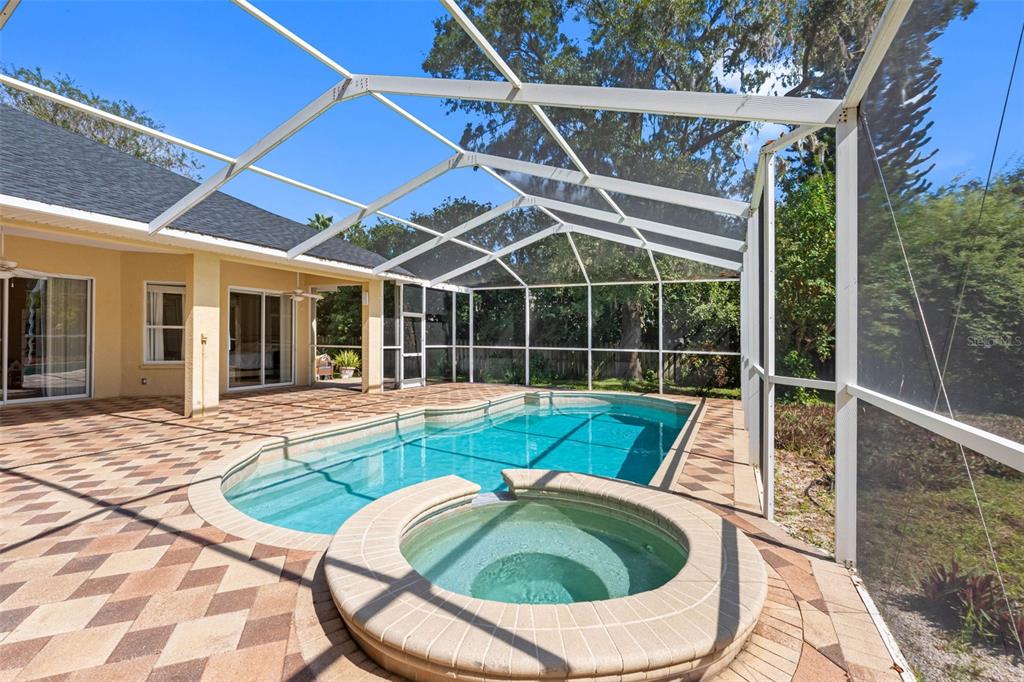 121 Myrtle Ridge Road Lutz, FL 33549 - Photo 8 of 42 a view of a swimming pool with a patio