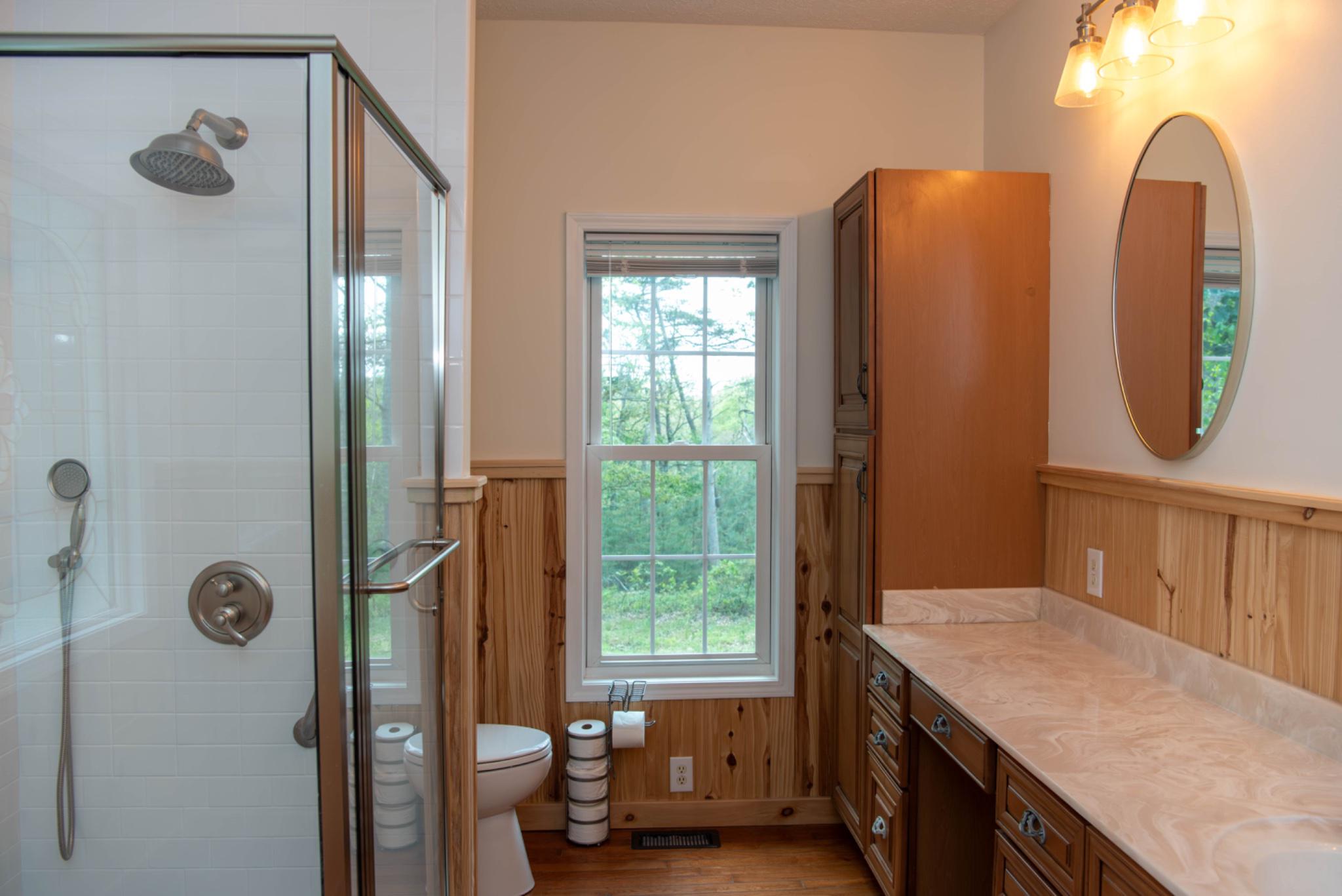 792 Forest Glen Road Moorefield, WV 26836 - Photo 65 of 146 Serene ensuite bathroom with natural light.