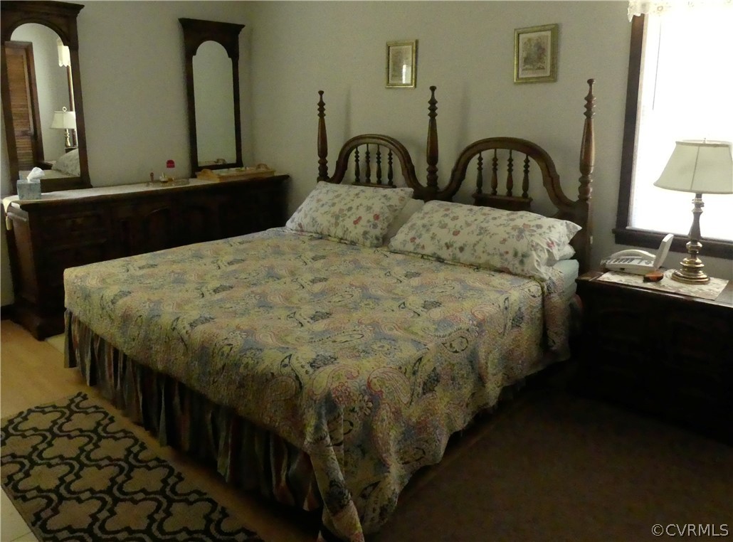 1876 Scotts Bottom Road Dillwyn, VA 23936 - Photo 11 of 30 a bedroom with bed and a table