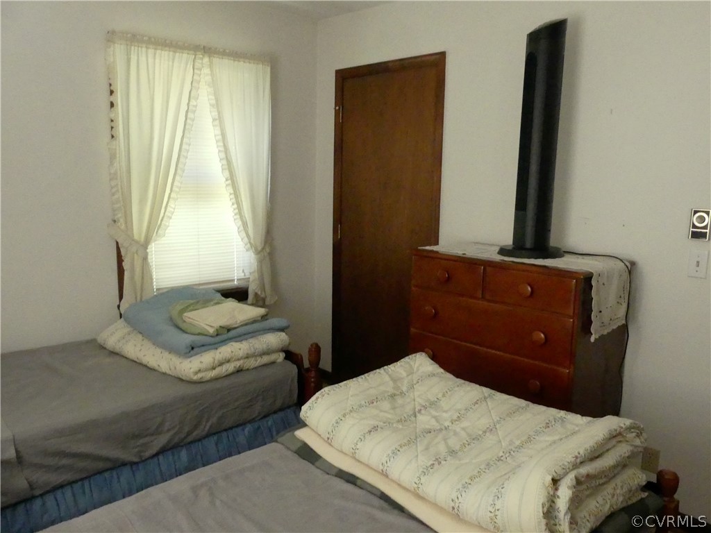 1876 Scotts Bottom Road Dillwyn, VA 23936 - Photo 16 of 30 a bedroom with a bed and a dresser