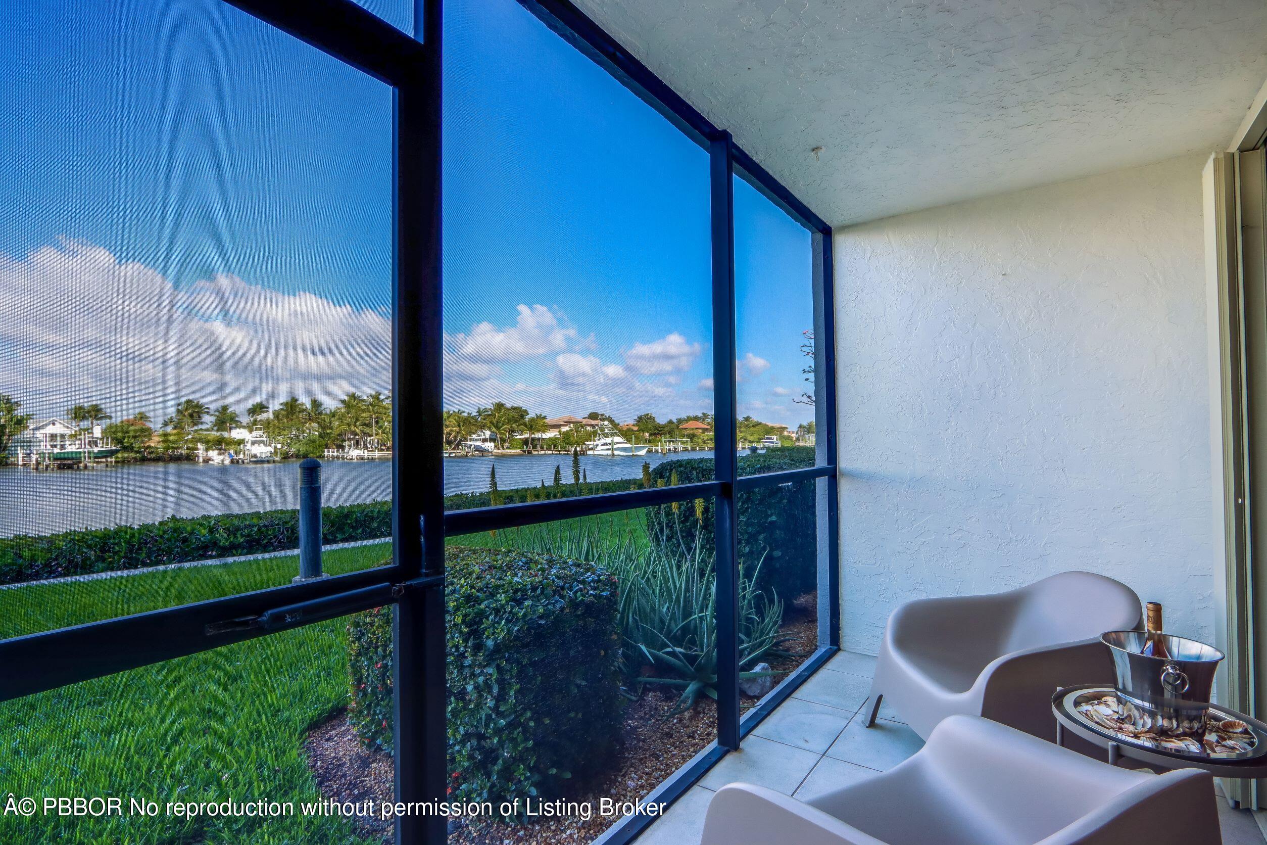 3525 South Ocean Boulevard, Unit 108 Palm Beach, FL 33480 - Photo 2 of 13 a view of a chair and table in the garden